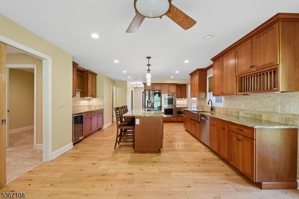 Chandelier, Dining room, Interior, Kitchen, Pendant Lights, Recessed Lighting, Stainless Steel Appliances, Wood Texture Flooring