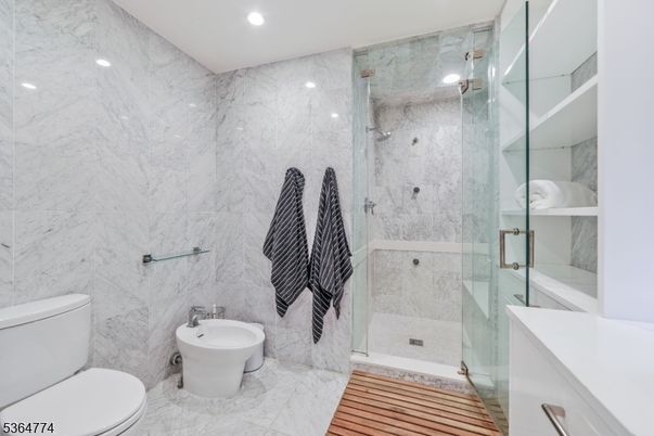 Bathroom, Glass Shower, Interior, Marble, Marble Walls, Recessed Lighting, Wood Texture Flooring
