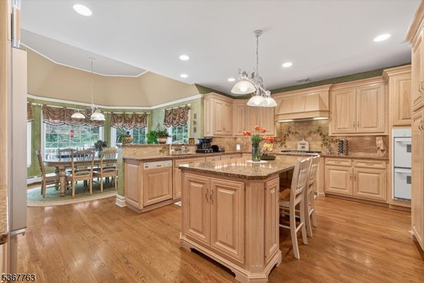 Chandelier, Dining room, Interior, Kitchen, Pendant Lights, Recessed Lighting, Stainless Steel Appliances, Wood Texture Flooring
