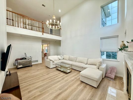 Chandelier, Fireplace, Interior, Living room, Recessed Lighting, Wood Texture Flooring