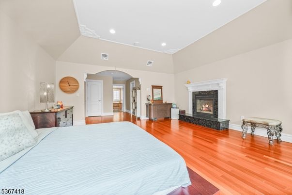 Bedroom, Fireplace, Interior, Recessed Lighting, Wood Texture Flooring