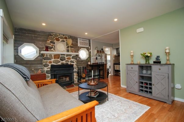 Fireplace, Interior, Living room, Recessed Lighting, Stone Walls, Wood Texture Flooring