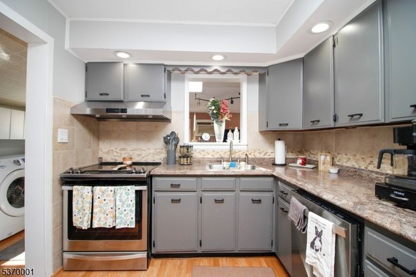 Interior, Kitchen, Recessed Lighting, Stainless Steel Appliances, Washer, Wood Texture Flooring