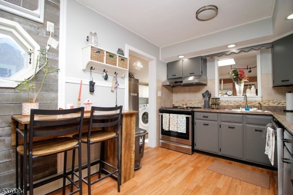Interior, Kitchen, Recessed Lighting, Stainless Steel Appliances, Washer, Wood Texture Flooring