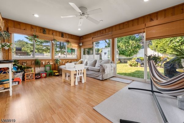 Fireplace, Interior, Living room, Recessed Lighting, Sun Room, Wood Texture Flooring, Wooden Walls
