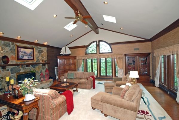 Fireplace, Interior, Living room, Recessed Lighting, Stone Walls, Wood Texture Flooring
