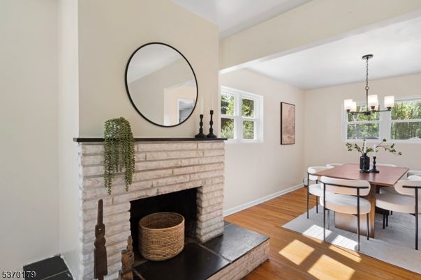 Chandelier, Dining room, Fireplace, Interior, Pendant Lights, Wood Texture Flooring