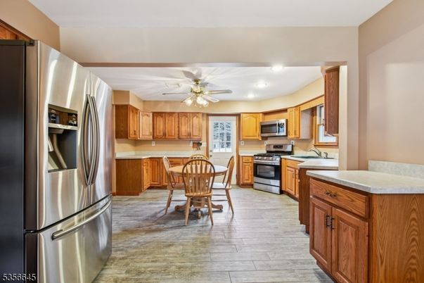 Dining room, Interior, Kitchen, Recessed Lighting, Stainless Steel Appliances, Wood Texture Flooring