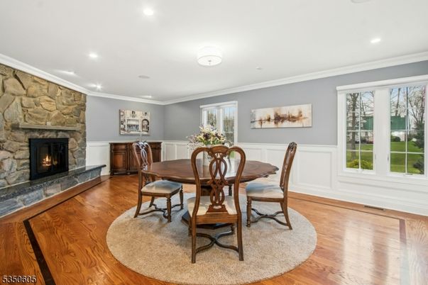 Dining room, Fireplace, Interior, Recessed Lighting, Stone Walls, Wood Texture Flooring