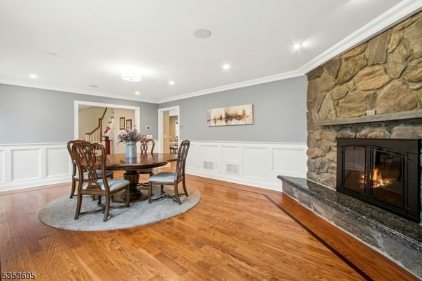 Dining room, Fireplace, Interior, Recessed Lighting, Stone Walls, Wood Texture Flooring