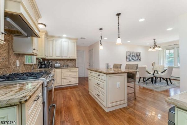 Chandelier, Dining room, Interior, Kitchen, Pendant Lights, Recessed Lighting, Stainless Steel Appliances, Wood Texture Flooring