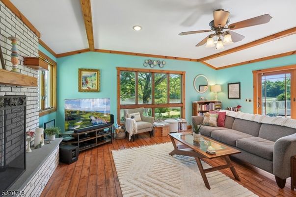 Fireplace, Interior, Living room, Recessed Lighting, Stone Walls, Wooden Beams, Wood Texture Flooring