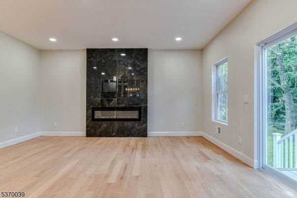 Empty room, Fireplace, Interior, Recessed Lighting, Wood Texture Flooring
