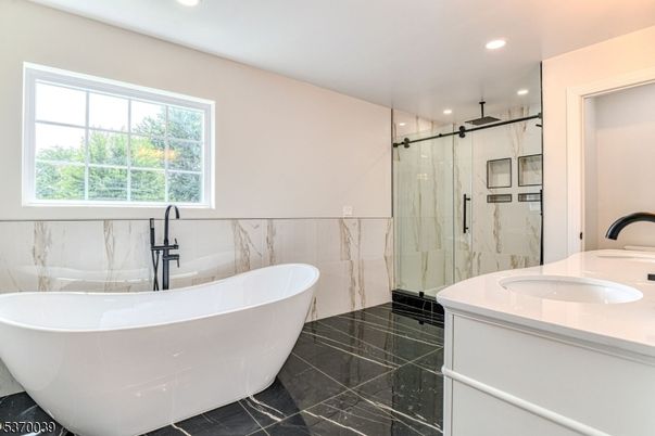 Bathroom, Dual Sink Vanities, Free Standing Baths, Glass Shower, Interior, Marble Walls, Recessed Lighting