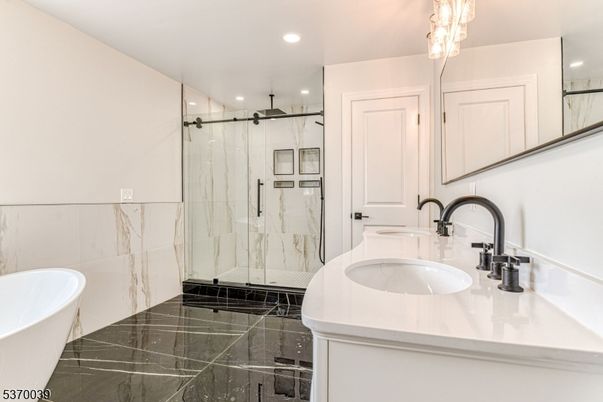 Bathroom, Dual Sink Vanities, Free Standing Baths, Glass Shower, Interior, Marble Walls, Recessed Lighting
