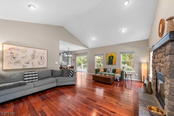 Chandelier, Dining room, Fireplace, Interior, Living room, Recessed Lighting, Stone Walls, Wood Texture Flooring