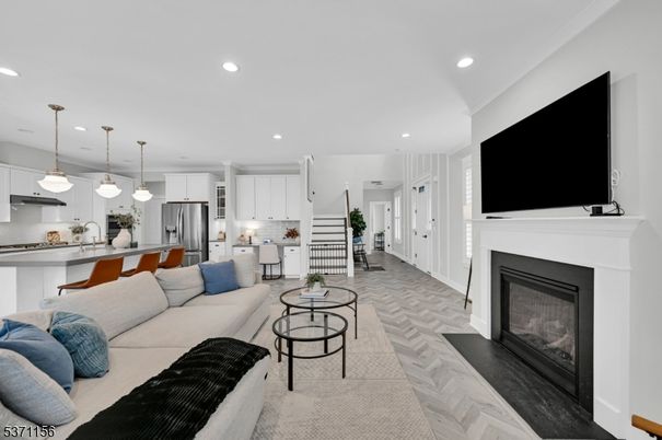 Fireplace, Interior, Kitchen, Living room, Pendant Lights, Recessed Lighting, Stainless Steel Appliances, Wood Texture Flooring