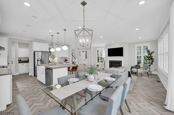 Dining room, Fireplace, Interior, Kitchen, Living room, Pendant Lights, Recessed Lighting, Stainless Steel Appliances, Wood Texture Flooring