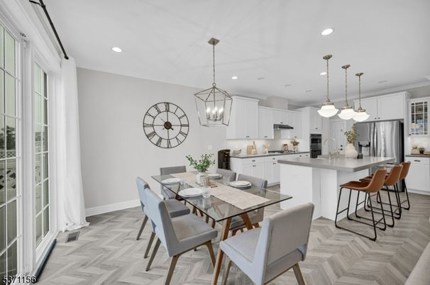 Chandelier, Dining room, Interior, Kitchen, Pendant Lights, Recessed Lighting, Stainless Steel Appliances, Wood Texture Flooring