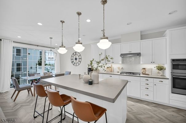 Dining room, Interior, Kitchen, Pendant Lights, Recessed Lighting, Stainless Steel Appliances, Wood Texture Flooring