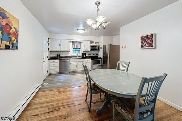 Dining room, Interior, Kitchen, Pendant Lights, Stainless Steel Appliances, Wood Texture Flooring