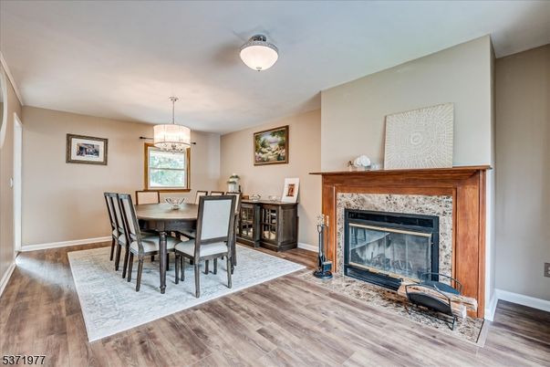 Dining room, Fireplace, Interior, Pendant Lights, Wood Texture Flooring