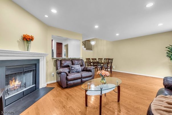 Dining room, Fireplace, Interior, Living room, Pendant Lights, Recessed Lighting, Wood Texture Flooring