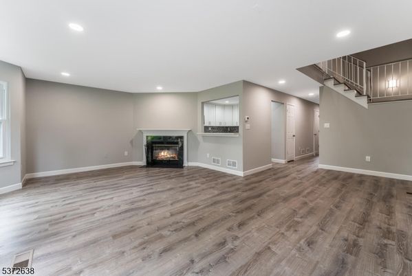 Empty room, Fireplace, Interior, Recessed Lighting, Wood Texture Flooring