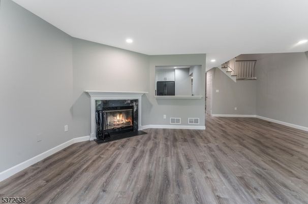 Empty room, Fireplace, Interior, Recessed Lighting, Wood Texture Flooring
