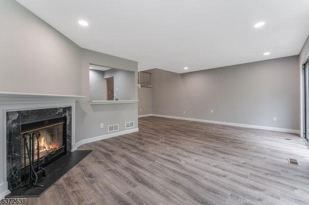 Empty room, Fireplace, Interior, Recessed Lighting, Wood Texture Flooring