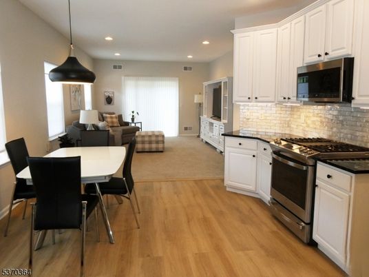 Dining room, Interior, Kitchen, Living room, Pendant Lights, Recessed Lighting, Stainless Steel Appliances, Wood Texture Flooring