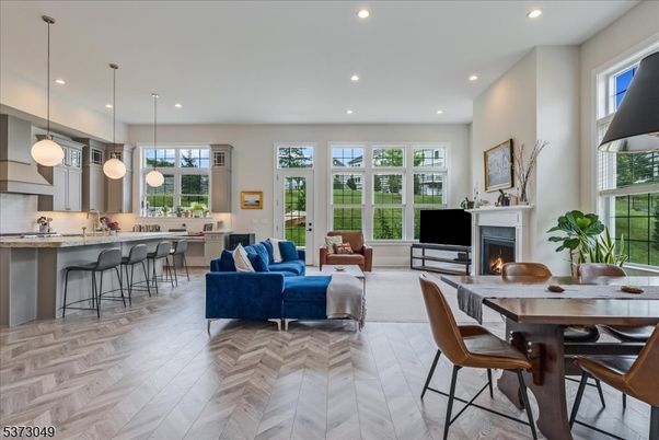 Dining room, Fireplace, Interior, Living room, Pendant Lights, Recessed Lighting, Wood Texture Flooring