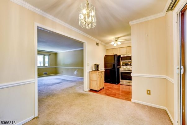 Chandelier, Empty room, Interior, Kitchen, Pendant Lights, Stainless Steel Appliances, Wood Texture Flooring