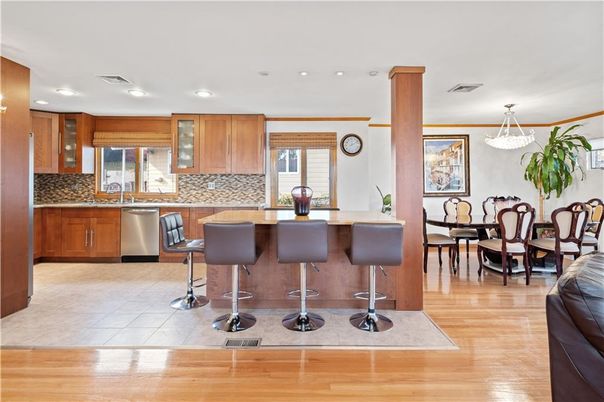 Dining room, Interior, Kitchen, Pendant Lights, Recessed Lighting, Stainless Steel Appliances, Wood Texture Flooring