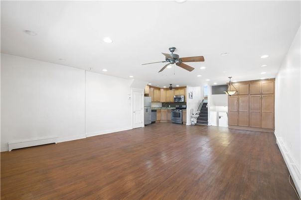 Empty room, Interior, Kitchen, Pendant Lights, Recessed Lighting, Stainless Steel Appliances, Wood Texture Flooring