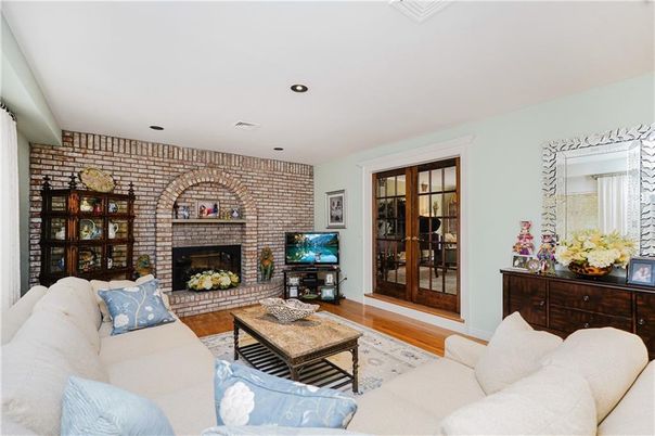 Fireplace, Interior, Living room, Recessed Lighting, Stone Walls, Wood Texture Flooring