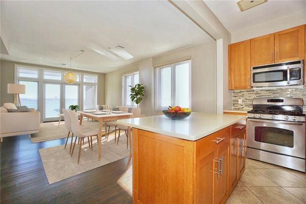 Dining room, Interior, Kitchen, Living room, Pendant Lights, Stainless Steel Appliances, Water, Wood Texture Flooring
