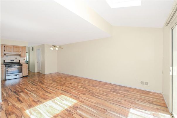 Empty room, Interior, Kitchen, Stainless Steel Appliances, Wood Texture Flooring
