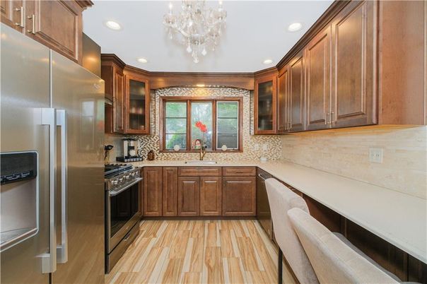 Chandelier, Interior, Kitchen, Recessed Lighting, Stainless Steel Appliances, Wood Texture Flooring