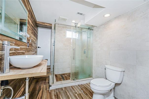 Bathroom, Glass Shower, Interior, Recessed Lighting, Stone Walls, Wood Texture Flooring