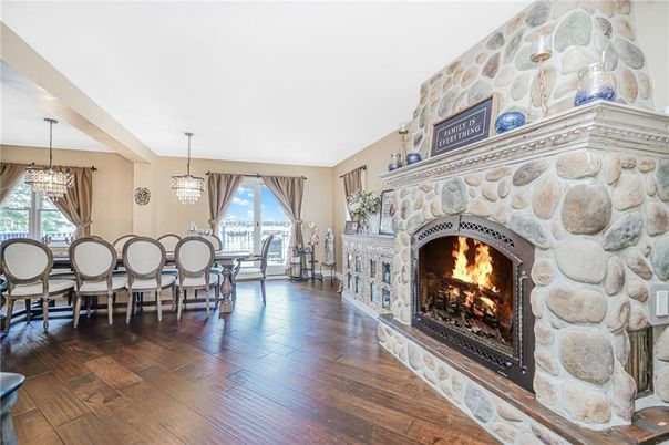 Chandelier, Dining room, Fireplace, Interior, Pendant Lights, Stone Walls, Wood Texture Flooring