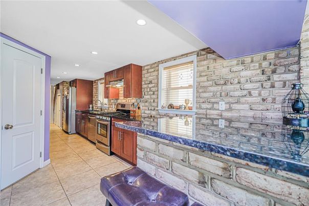 Interior, Kitchen, Recessed Lighting, Stainless Steel Appliances, Stone Walls