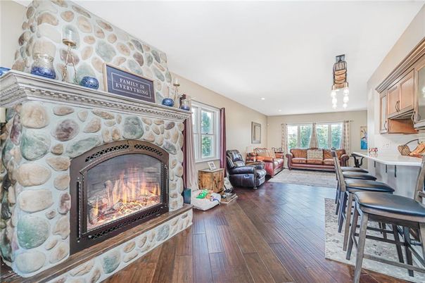 Fireplace, Interior, Living room, Recessed Lighting, Stone Walls, Wood Texture Flooring