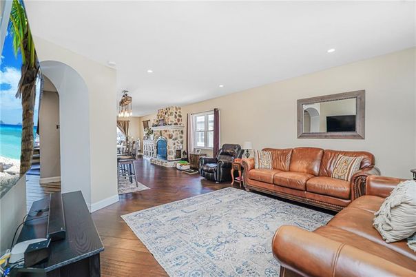 Fireplace, Interior, Living room, Recessed Lighting, Stone Walls, Wood Texture Flooring