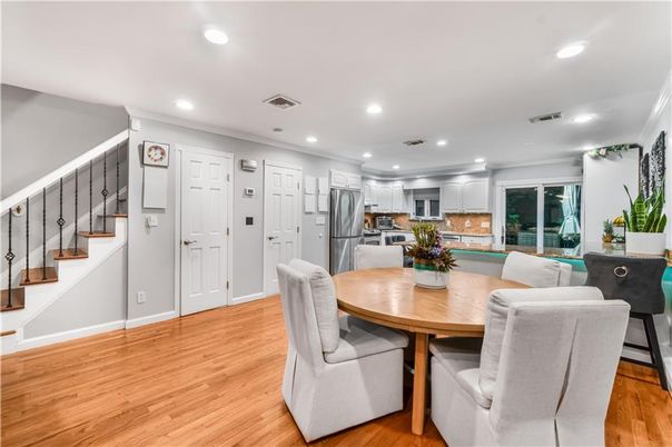 Dining room, Interior, Kitchen, Recessed Lighting, Stainless Steel Appliances, Wood Texture Flooring