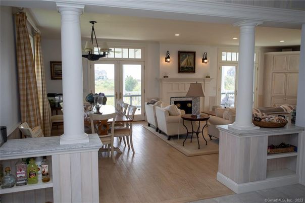 Dining room, Fireplace, Interior, Living room, Pendant Lights, Recessed Lighting, Wood Texture Flooring