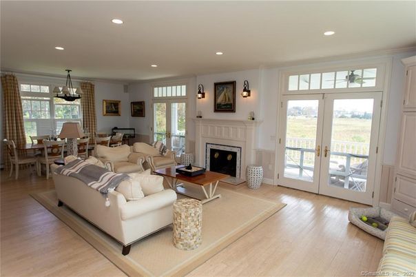 Chandelier, Dining room, Fireplace, Interior, Living room, Pendant Lights, Recessed Lighting, Wood Texture Flooring