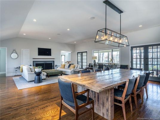 Dining room, Fireplace, Interior, Living room, Pendant Lights, Recessed Lighting, Wood Texture Flooring