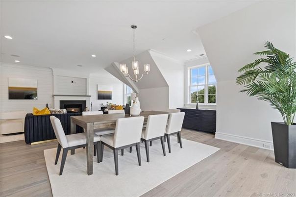 Chandelier, Dining room, Fireplace, Interior, Living room, Pendant Lights, Recessed Lighting, Wood Texture Flooring
