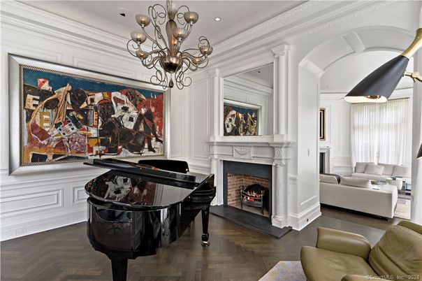 Chandelier, Fireplace, Interior, Living room, Piano, Recessed Lighting, Wood Texture Flooring